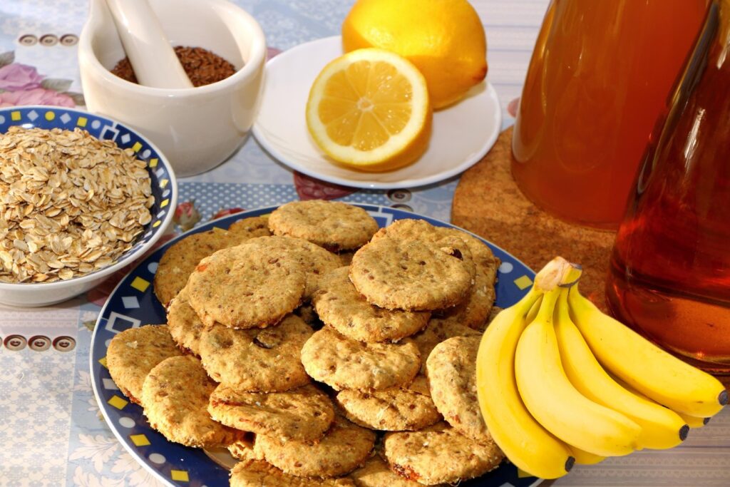 Homemade oat and banana cookies with natural ingredients like honey, lemon, flaxseeds, and oats – healthy snacks for kids