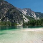 Hidden mountain lake with emerald water and forest – one of the 10 unique places to visit in India