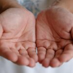 Close-up image of open human palms showing palm lines, illustrating what your palm lines say about you