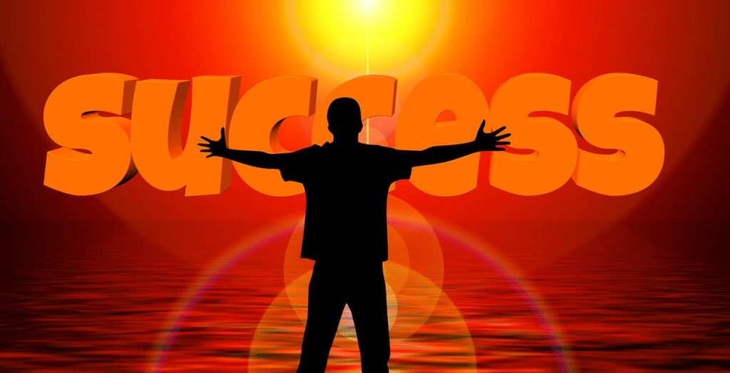 Silhouette of a person embracing success at sunrise, symbolizing the daily routine of a successful person