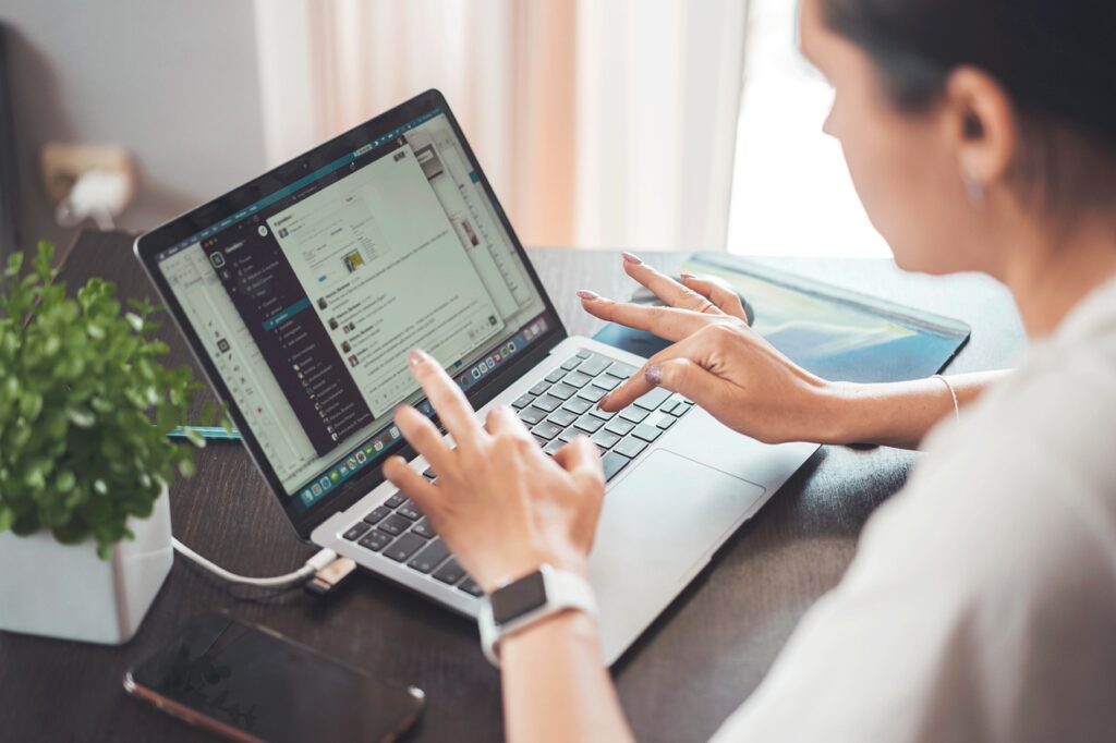 Woman researching how to get a remote job with no experience while working on a laptop at home