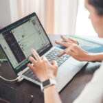 Woman researching how to get a remote job with no experience while working on a laptop at home