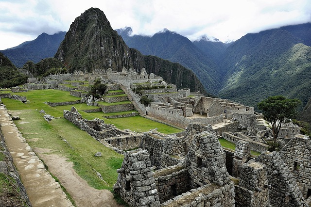 Ancient Incan citadel of Machu Picchu nestled in the Andes Mountains of Peru, showcasing stone ruins and lush green terraces