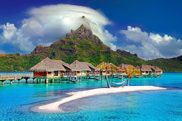 Breathtaking view of Bora Bora with turquoise waters, luxury overwater bungalows, and Mount Otemanu in the background – one of the most beautiful places in the world