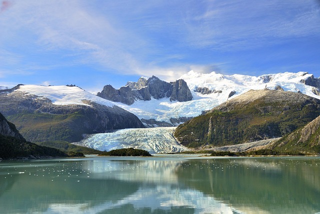 Most beautiful places in the world – stunning glacier and snow-capped peaks reflected in the serene waters of Patagonia.