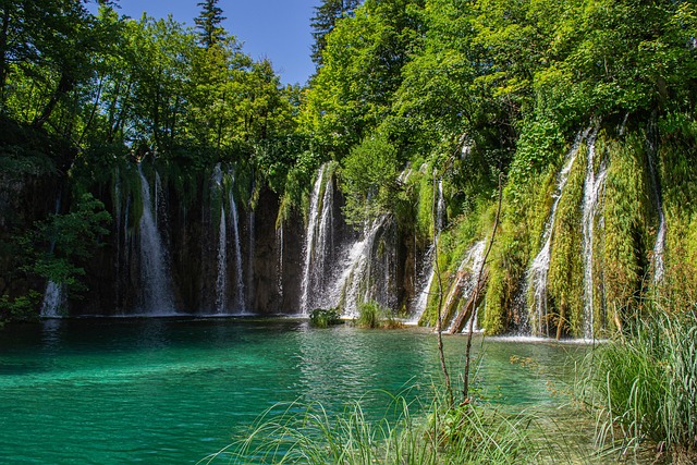 Most beautiful places in the world – crystal-clear turquoise water and cascading waterfalls at Plitvice Lakes National Park, Croatia.