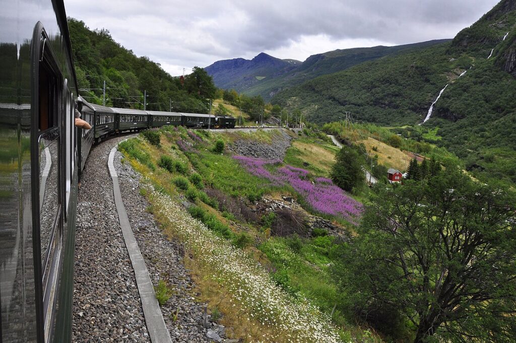 The Flam Railway in Norway, one of the most scenic train rides in the world, running through fjords, waterfalls, and steep mountain landscapes.