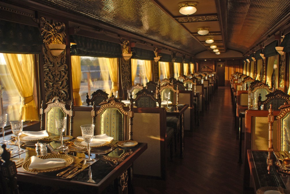 The Maharajas’ Express in India, one of the most scenic and luxurious train rides in the world, offering views of Rajasthan deserts, palaces, and cultural heritage.