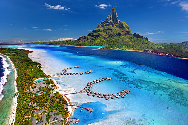 Scenic view of Bora Bora in French Polynesia with Mount Otemanu, turquoise lagoons, and overwater bungalows, making it one of the most breathtaking tropical islands to visit.
